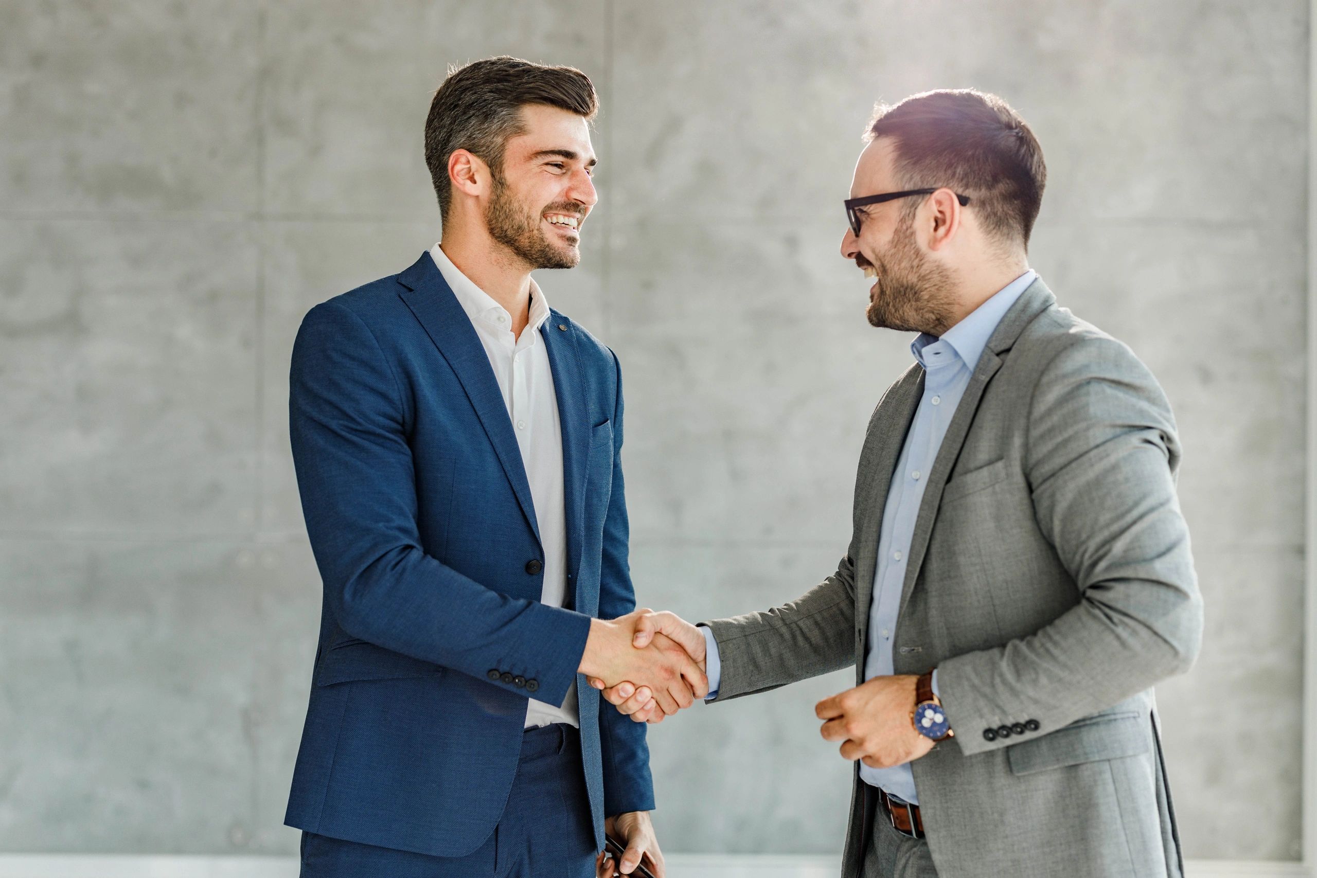 Professional handshake in an office, representing trust and a clear next step